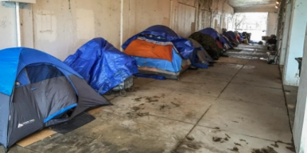 Row of homeless tents in an underpass